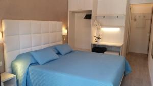 Posteľ alebo postele v izbe v ubytovaní Hotel Acapulco