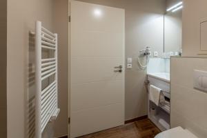 Ett badrum på All Suites Bordeaux Marne – Gare Saint-Jean