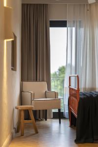 A bed or beds in a room at Yacht Boheme Hotel-Boutique Class - Adults Only