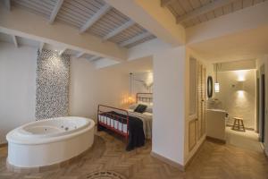 A bed or beds in a room at Yacht Boheme Hotel-Boutique Class - Adults Only