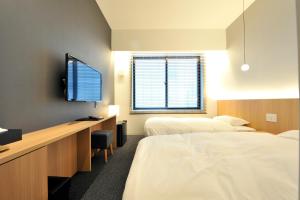 FUGASTAY Shijo Omiya tesisinde bir odada yatak veya yataklar