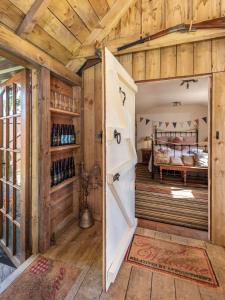 a barn door in a room with a bedroom at The Love Shack nr Elie & St Andrews in Ceres