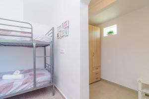 A bed or beds in a room at Es Pont Den Teulari Nou