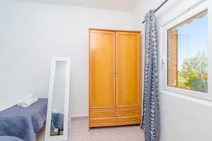 A bed or beds in a room at Es Pont Den Teulari Nou