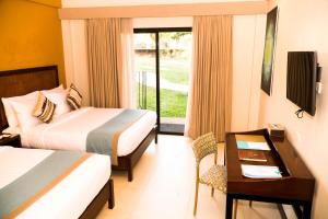 TV a/nebo společenská místnost v ubytování Bacau Bay Resort Coron