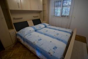 Postel nebo postele na pokoji v ubytování Apartments Topo