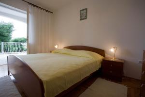 Postel nebo postele na pokoji v ubytování Apartments Topo