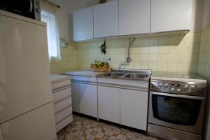 Kuchyň nebo kuchyňský kout v ubytování Apartments Topo