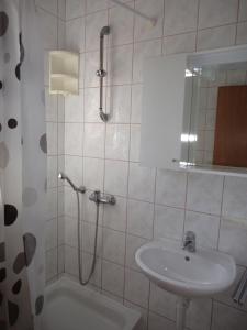 Koupelna v ubytování Jandric Apartments + 10 fotografií