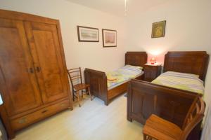 Postel nebo postele na pokoji v ubytování Apartments Neven