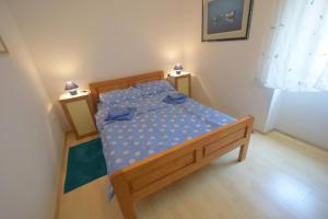 Postel nebo postele na pokoji v ubytování Apartments Neven