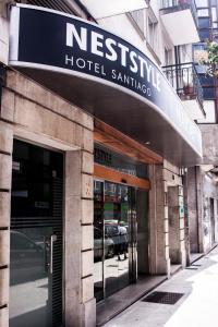 a building with a sign on the side of it at Nest Style Santiago in Santiago de Compostela