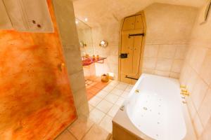 a bathroom with a toilet and a shower at Hotel San Gabriele in Rosenheim