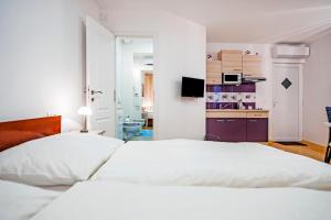 Postel nebo postele na pokoji v ubytování La Svalba Rooms & Studios