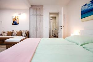 Postel nebo postele na pokoji v ubytování La Svalba Rooms & Studios