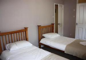 Postel nebo postele na pokoji v ubytování St Helens Apartment 1