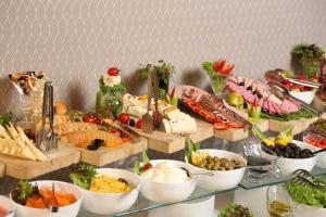 a buffet with lots of different types of food at Borjomi Likani Health & Spa Centre in Borjomi
