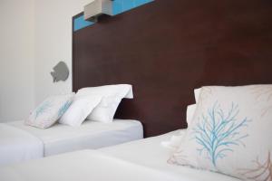 Voodi või voodid majutusasutuse Hotel Dunas de Sal toas