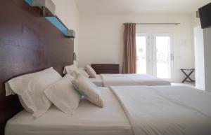 Voodi või voodid majutusasutuse Hotel Dunas de Sal toas