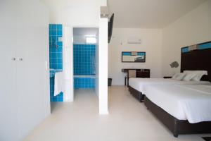 Voodi või voodid majutusasutuse Hotel Dunas de Sal toas
