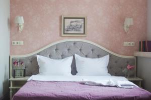 Postel nebo postele na pokoji v ubytování Hotel 19