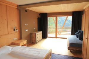 Katil atau katil-katil dalam bilik di Bike & Ski Hotel Diana