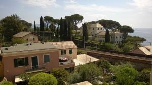 a view of a town with houses and trees at House Orizzonte - Casa Bianca in Genoa