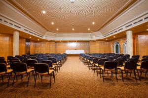 a large room with chairs and a table in it at El Mouradi El Menzah in Hammamet +88 photos