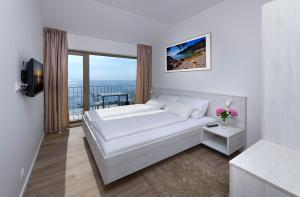 Postel nebo postele na pokoji v ubytování Zlatni Zalaz,Apartments,Supetarska Draga