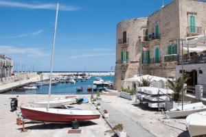 a group of boats docked in a harbor at Casa Bianca in Giovinazzo