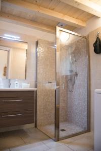 a bathroom with a glass shower with a sink at Casa Bianca in Giovinazzo