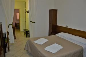 Postel nebo postele na pokoji v ubytování Hotel Belvedere
