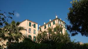 a tall building with a antenna on top of it at House Orizzonte - Casa Bianca in Genoa