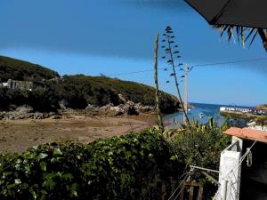 a view of the beach from a house at A Casinha da Baía in Porto Covo