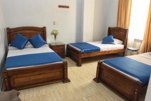 Postel nebo postele na pokoji v ubytování Hotel el Lago 2