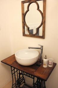 a bathroom with a white sink and a mirror at La Casetta Ferrara B&B in Ferrara