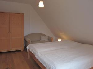 Кровать или кровати в номере Ferienwohnung Passivhaus "Schöne Aussicht"