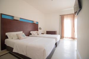 Voodi või voodid majutusasutuse Hotel Dunas de Sal toas