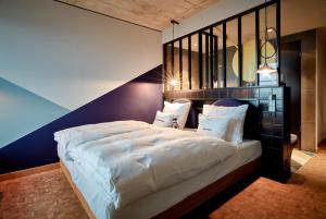 25hours Hotel Das Tourにあるベッド