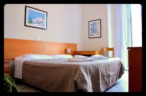 Postel nebo postele na pokoji v ubytování Hotel Belvedere + 11 fotografií