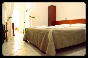Postel nebo postele na pokoji v ubytování Hotel Belvedere