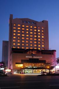 a hotel panorama building at night with the lights on at Hotel Paragon in Busan