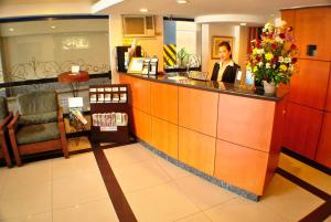 a woman sitting at a counter in a salon at Fersal Hotel - Manila in Manila +43 photos