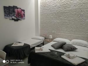 Postel nebo postele na pokoji v ubytování B&B Il mandorlo