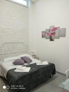 Postel nebo postele na pokoji v ubytování B&B Il mandorlo