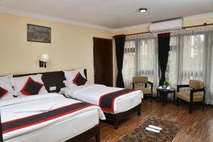 Postel nebo postele na pokoji v ubytování Taleju Boutique Hotel