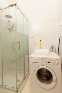 a washing machine in a bathroom with a shower at Apartment Atlantis in Pula