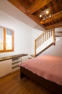 a bedroom with a loft bed and a window at Apartment Atlantis in Pula