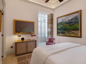 Posteľ alebo postele v izbe v ubytovaní Hotel Gloria de Sant Jaume
