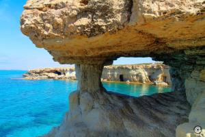 a view of the ocean and a rock formation at MyNapa Apartments in Ayia Napa